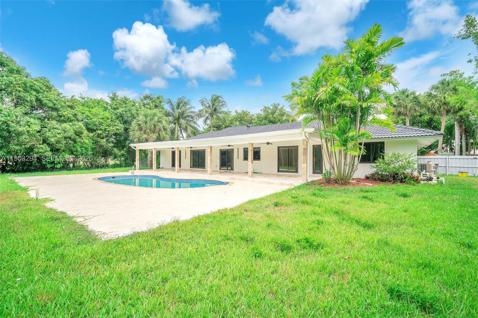 11476 Sundance Lane Boca Raton, FL 33428 - Photo 3 of 45 a front view of house with yard and green space