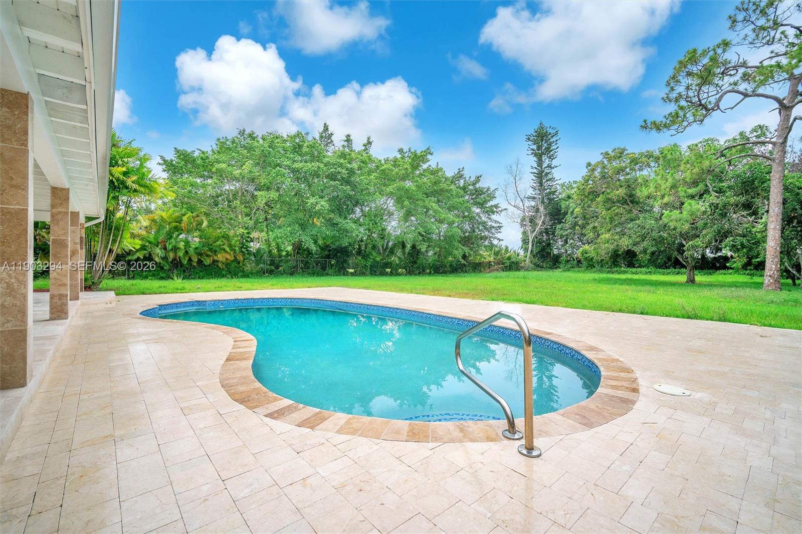 11476 Sundance Lane Boca Raton, FL 33428 - Photo 40 of 45 a view of a swimming pool with a yard
