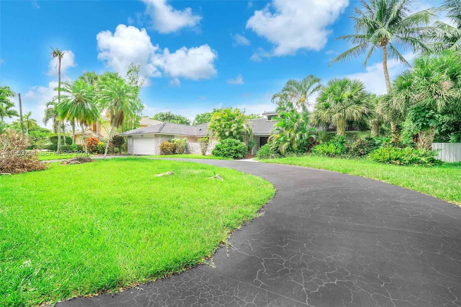 11476 Sundance Lane Boca Raton, FL 33428 - Photo 44 of 45 a view of a house with a big yard and palm trees