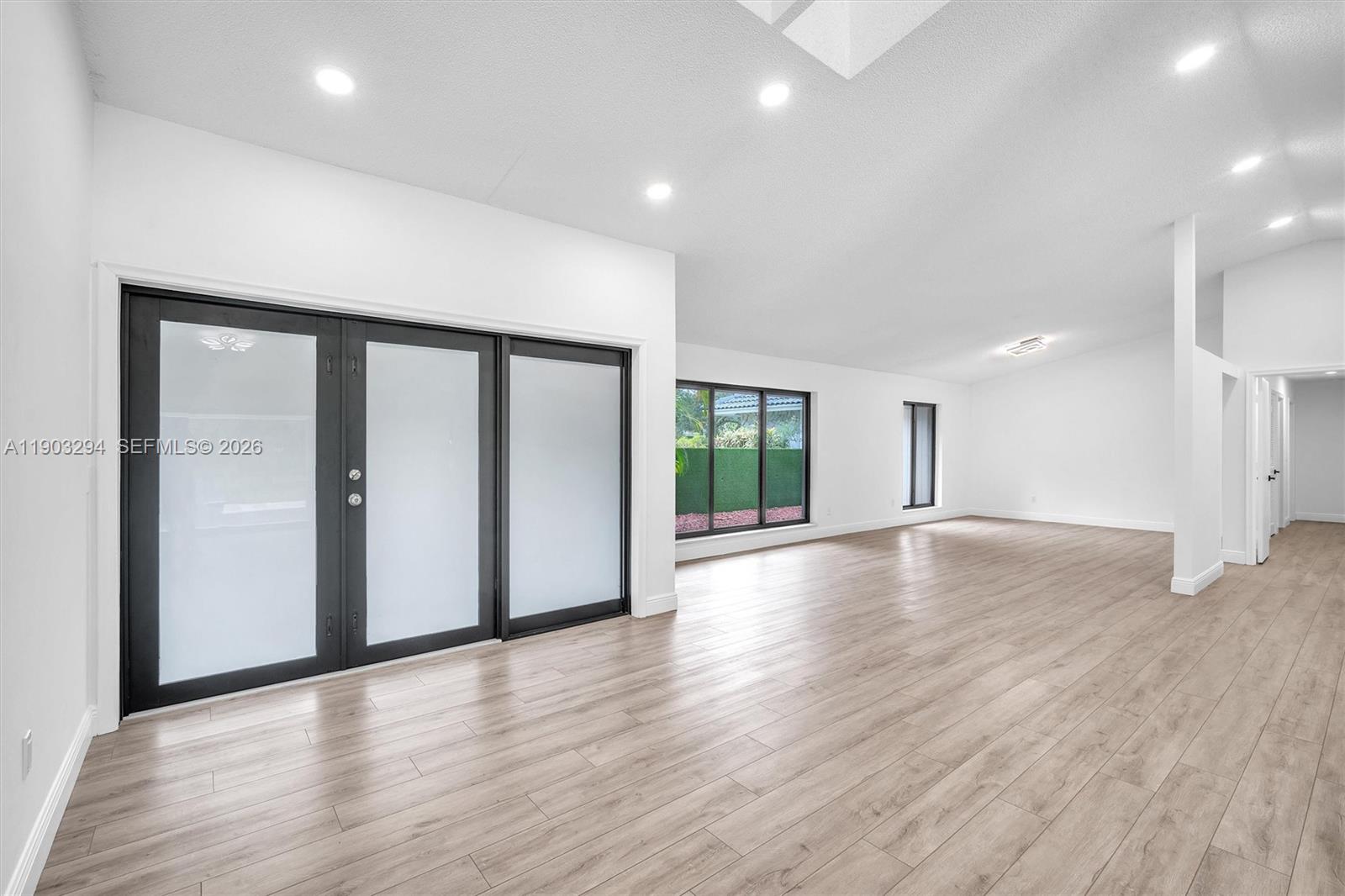 11476 Sundance Lane Boca Raton, FL 33428 - Photo 6 of 45 a view of a livingroom with wooden floor