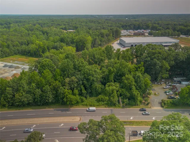an aerial view of a house with outdoor space