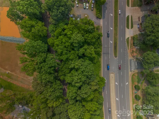 an aerial view of a house with a tree