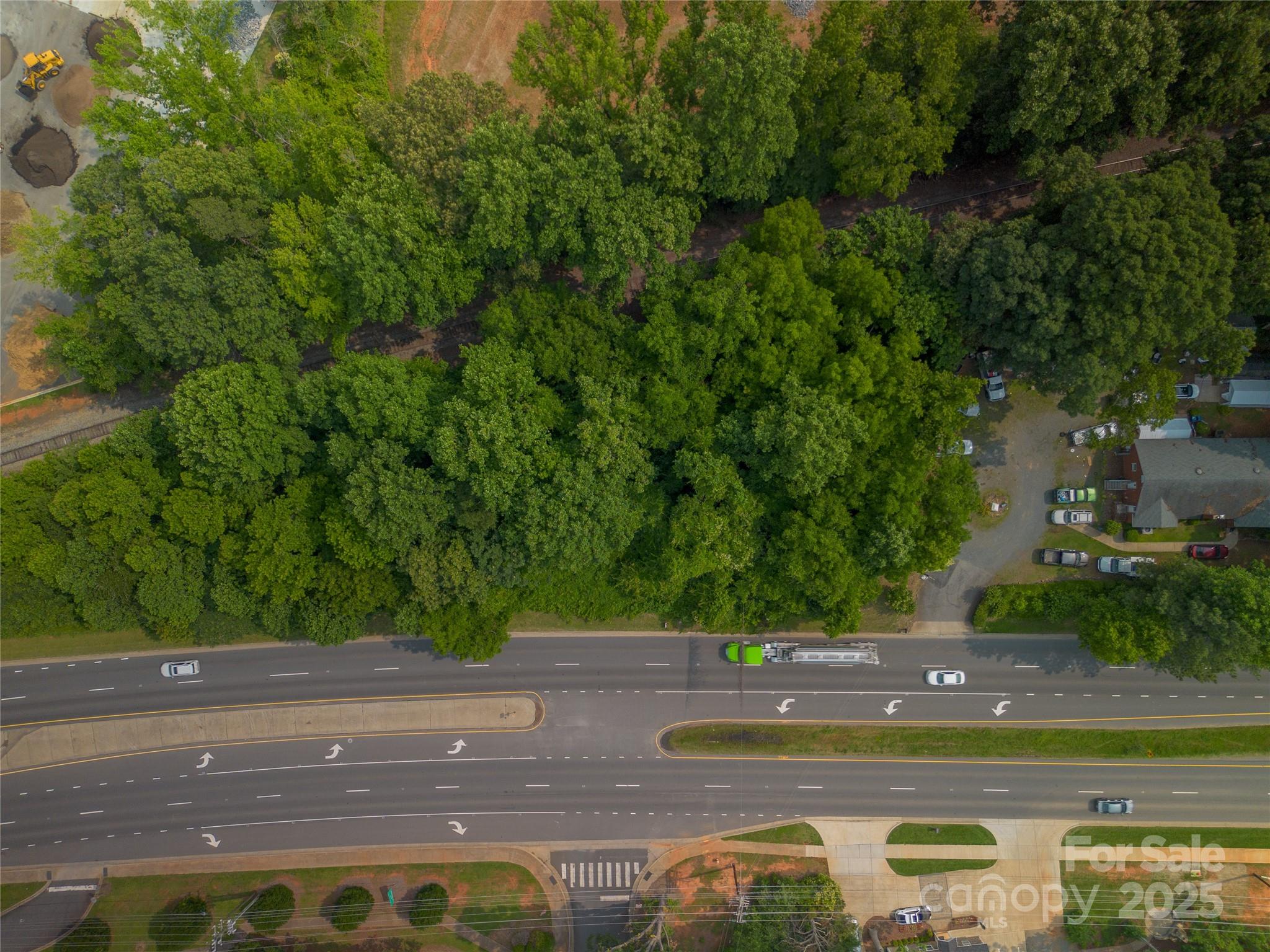 13428 Albemarle Road Charlotte, NC 28227 - Photo 3 of 5 a view of a swimming pool with a yard
