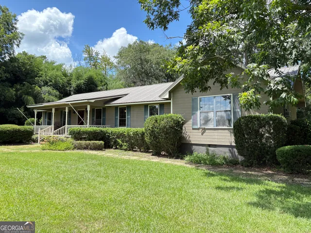 a backyard of a house with lots of green space