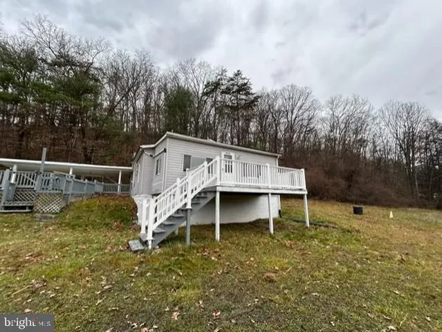 a view of a house with a yard from a balcony