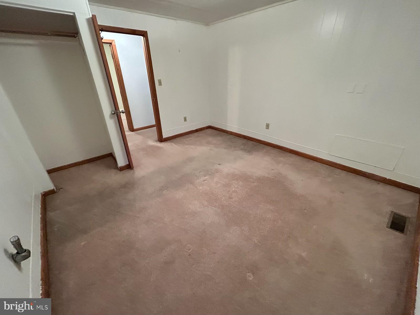 22704 Oldtown Road Southeast Oldtown, MD 21555 - Photo 5 of 15 an empty room with a mirror