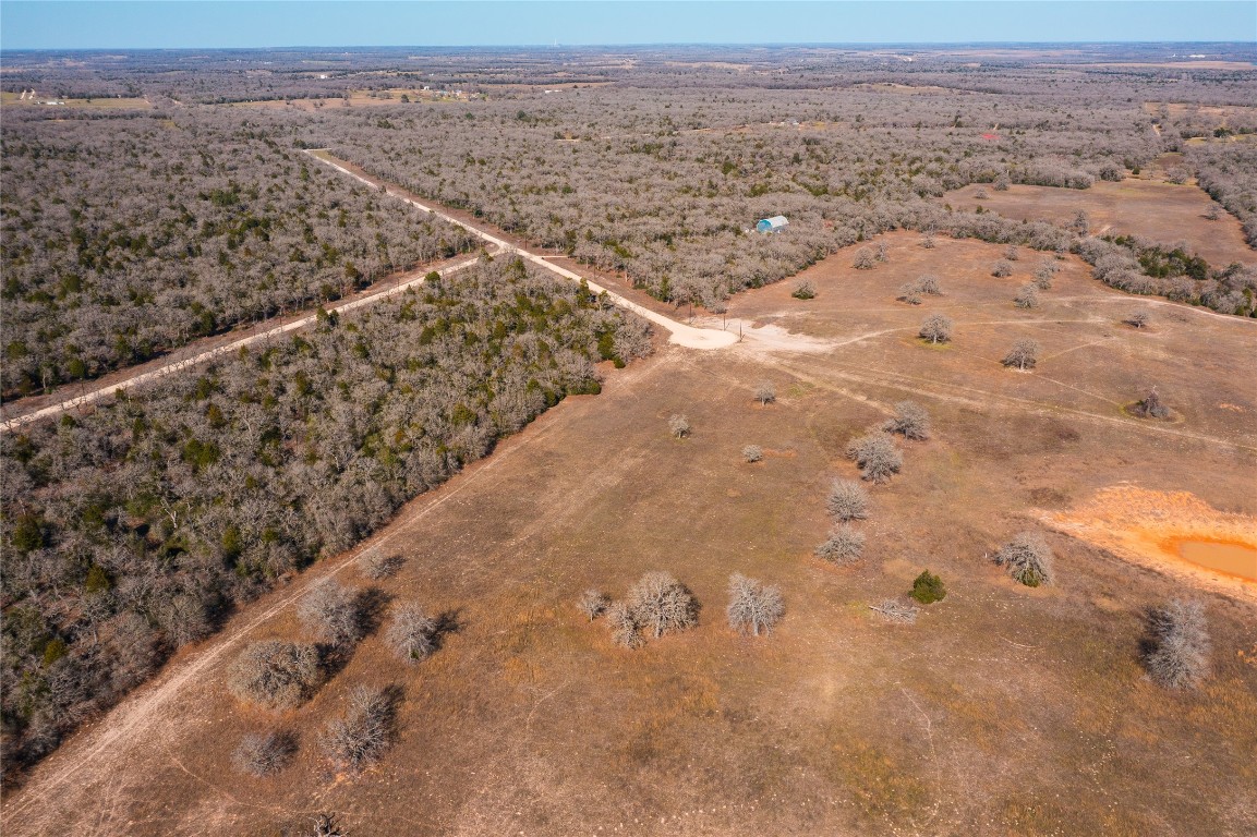 Lot 18 Oakview Lane Thrall, TX 76578 - Photo 5 of 7 a view of a dry yard with wooden fence