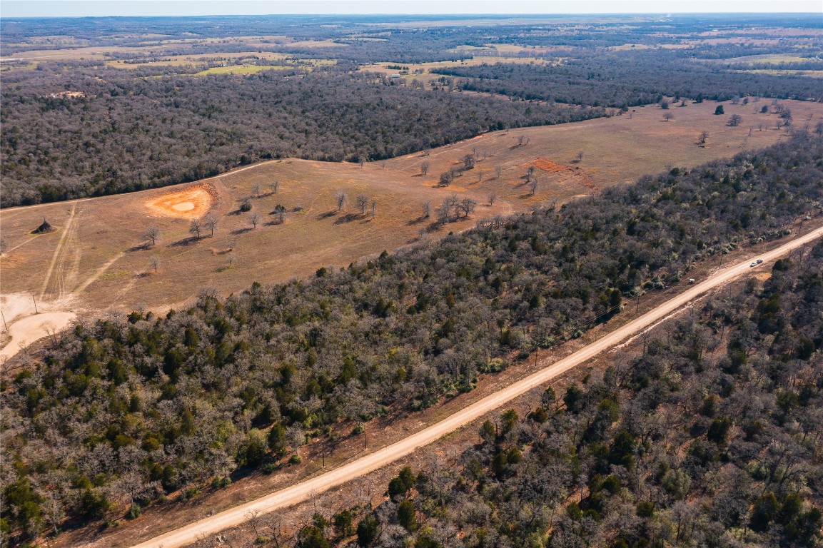 Lot 18 Oakview Lane Thrall, TX 76578 - Photo 6 of 7 a view of a dry yard with wooden fence