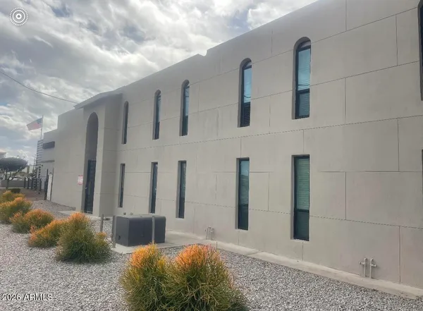 a large white building with glass door