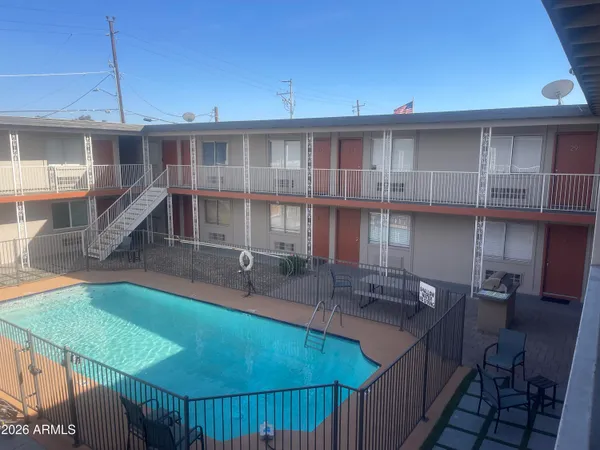 a kitchen with a sink a counter and cabinets