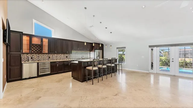 a bathroom with a granite countertop sink a mirror and a shower