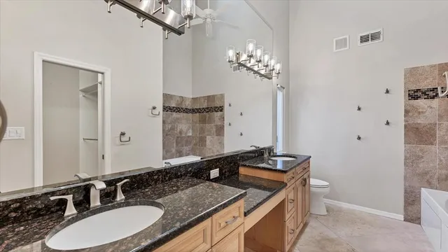an aerial view of residential houses with swimming pool and outdoor space