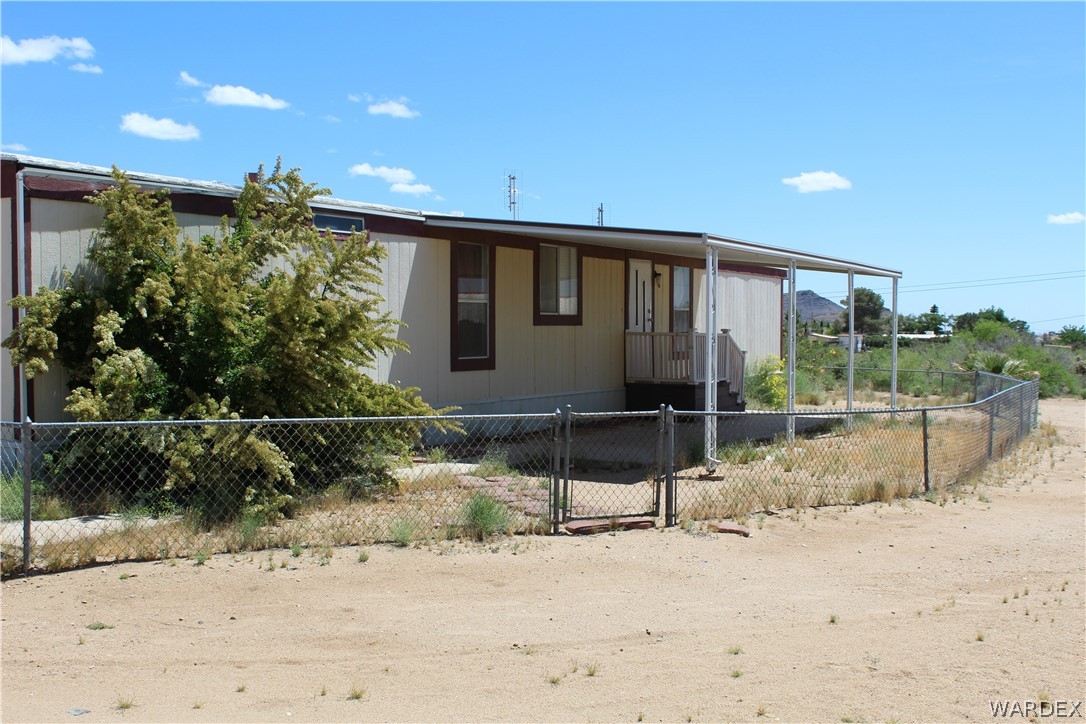 3635 Bowie Road Golden Valley, AZ 86413 - Photo 3 of 15 a front view of a house with a yard