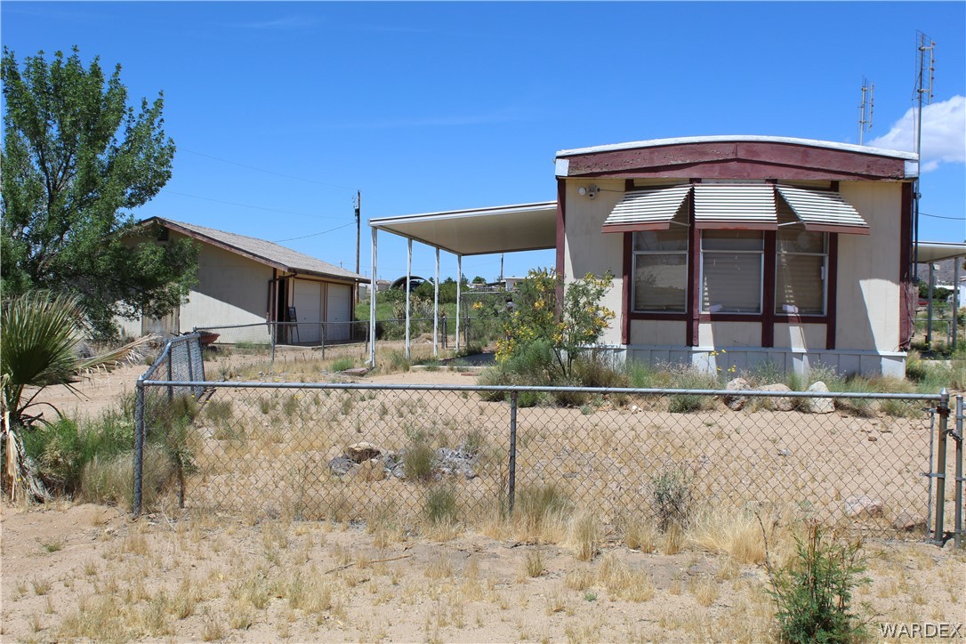 3635 Bowie Road Golden Valley, AZ 86413 - Photo 4 of 15 a view of a house with a yard