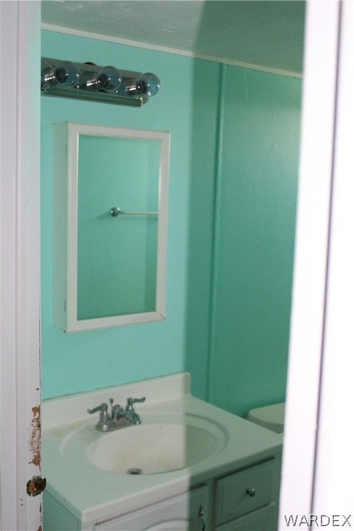 3635 Bowie Road Golden Valley, AZ 86413 - Photo 10 of 15 a bathroom with a sink and a mirror