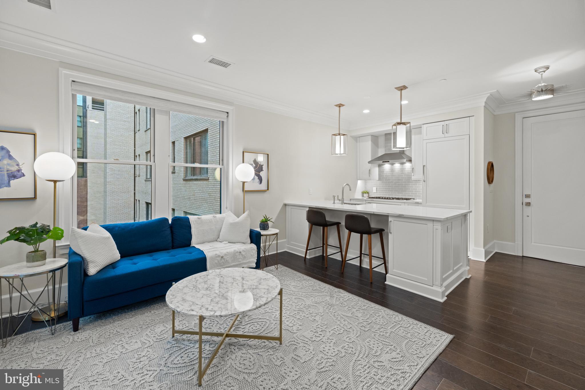 1108 16th Street Northwest, Unit 504 Washington, DC 20036 - Photo 6 of 22 a living room with furniture and a wooden floor