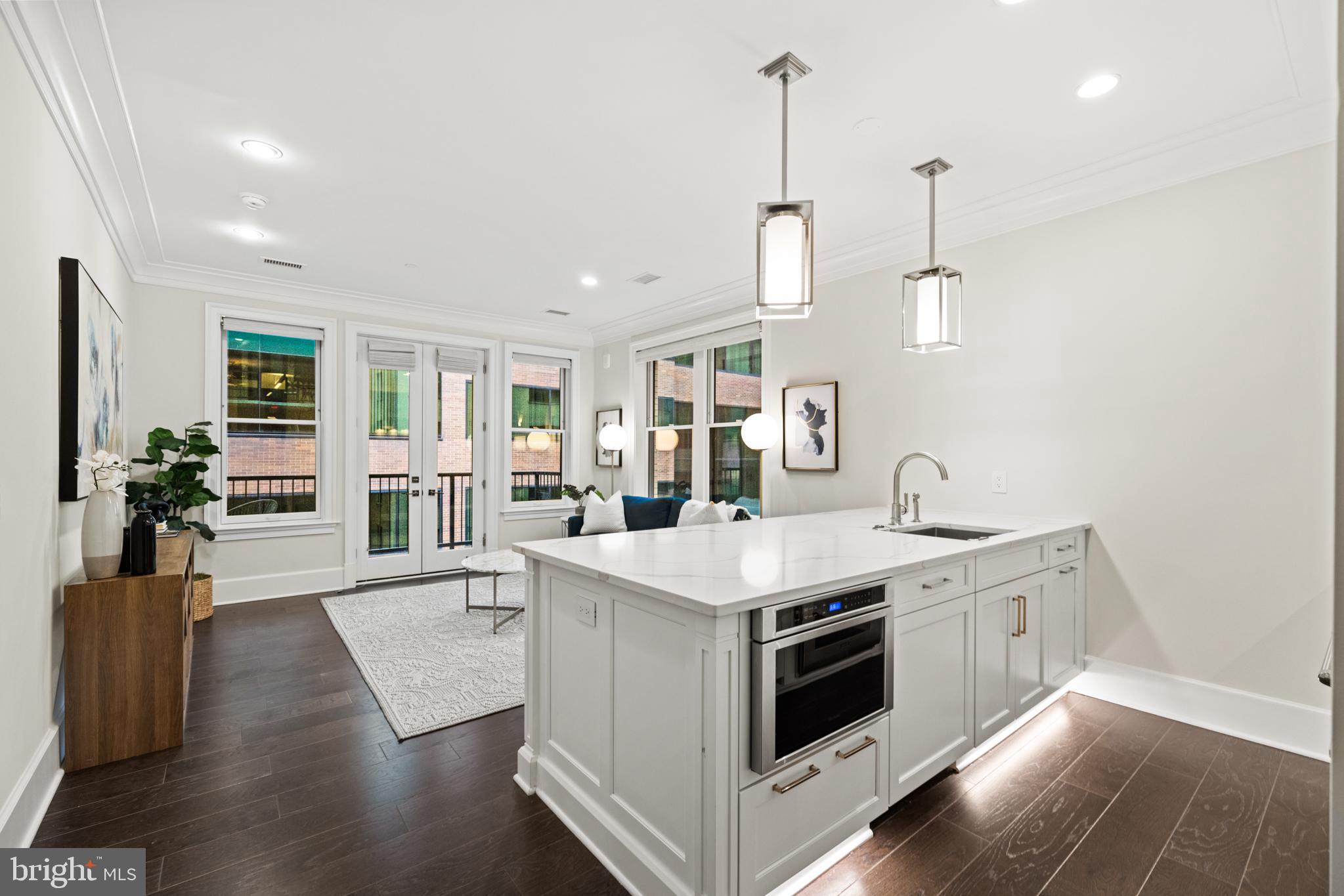 1108 16th Street Northwest, Unit 504 Washington, DC 20036 - Photo 9 of 22 a view of living room with furniture and flat screen tv