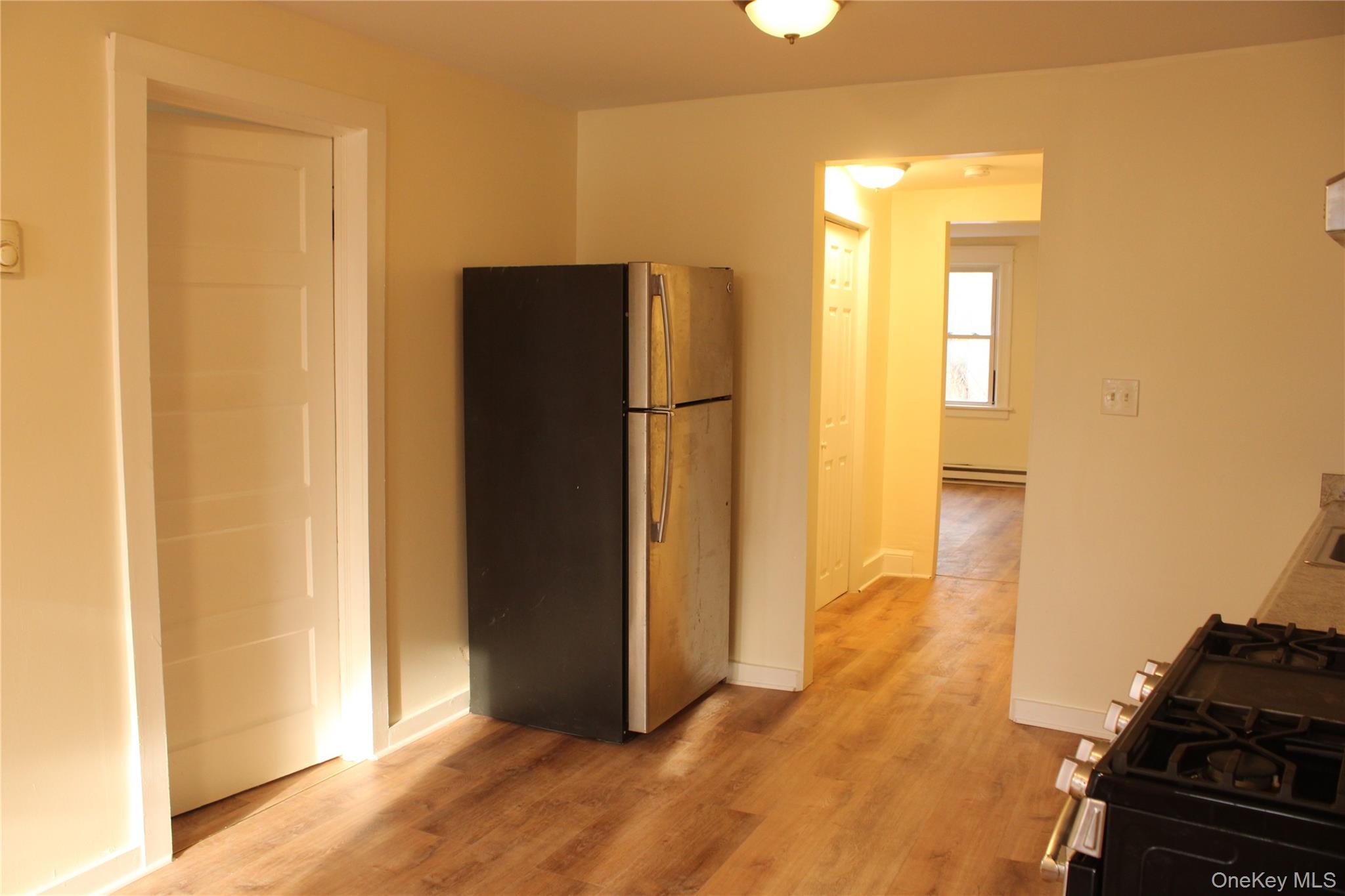 52 South Bridge Street, Unit 1 Poughkeepsie, NY 12601 - Photo 16 of 27 a view of a hallway with wooden floor