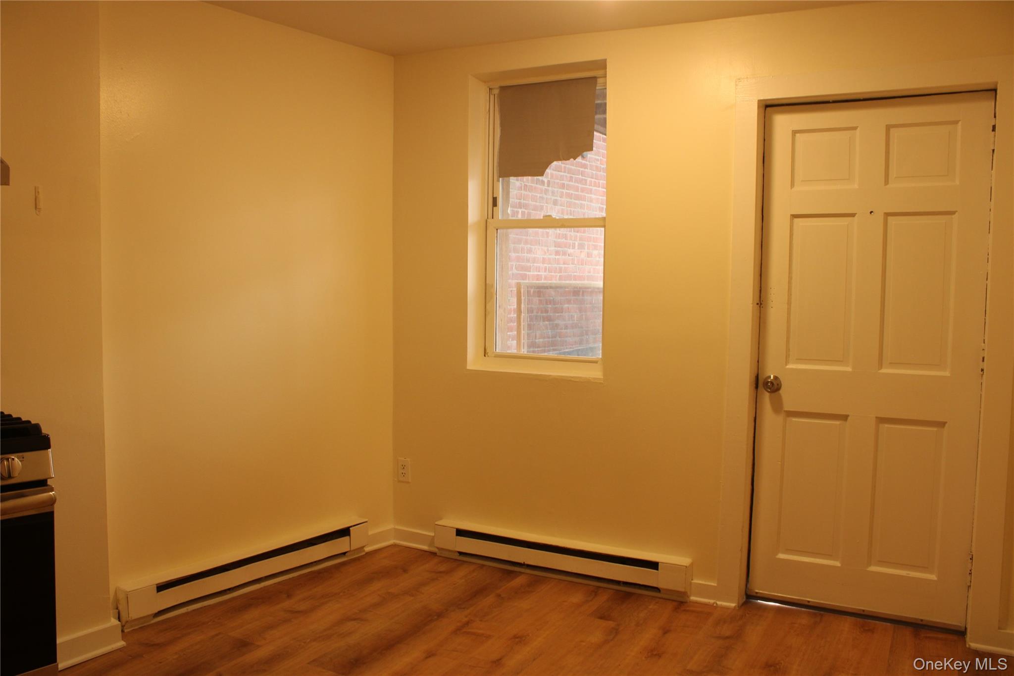 52 South Bridge Street, Unit 1 Poughkeepsie, NY 12601 - Photo 19 of 27 an empty room with wooden floor and closet