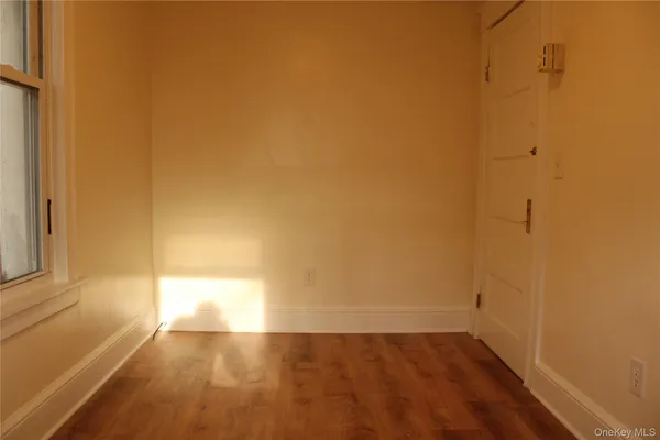 a view of an empty room and window