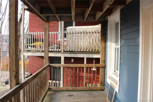 a view of a balcony with furniture
