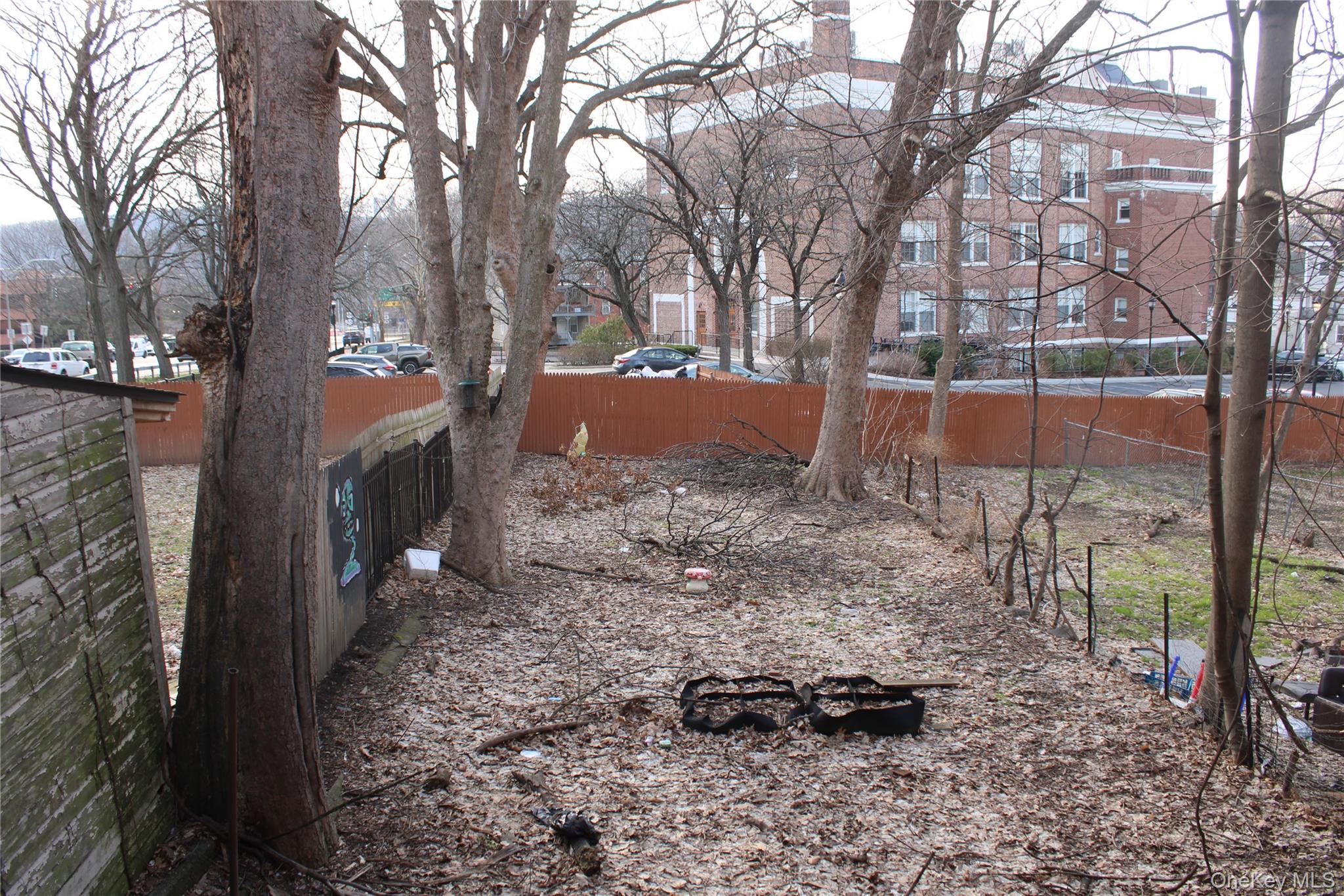 52 South Bridge Street, Unit 1 Poughkeepsie, NY 12601 - Photo 26 of 27 a backyard of a house with lots of green space