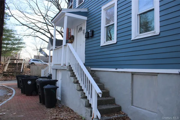 a view of a house with wooden deck