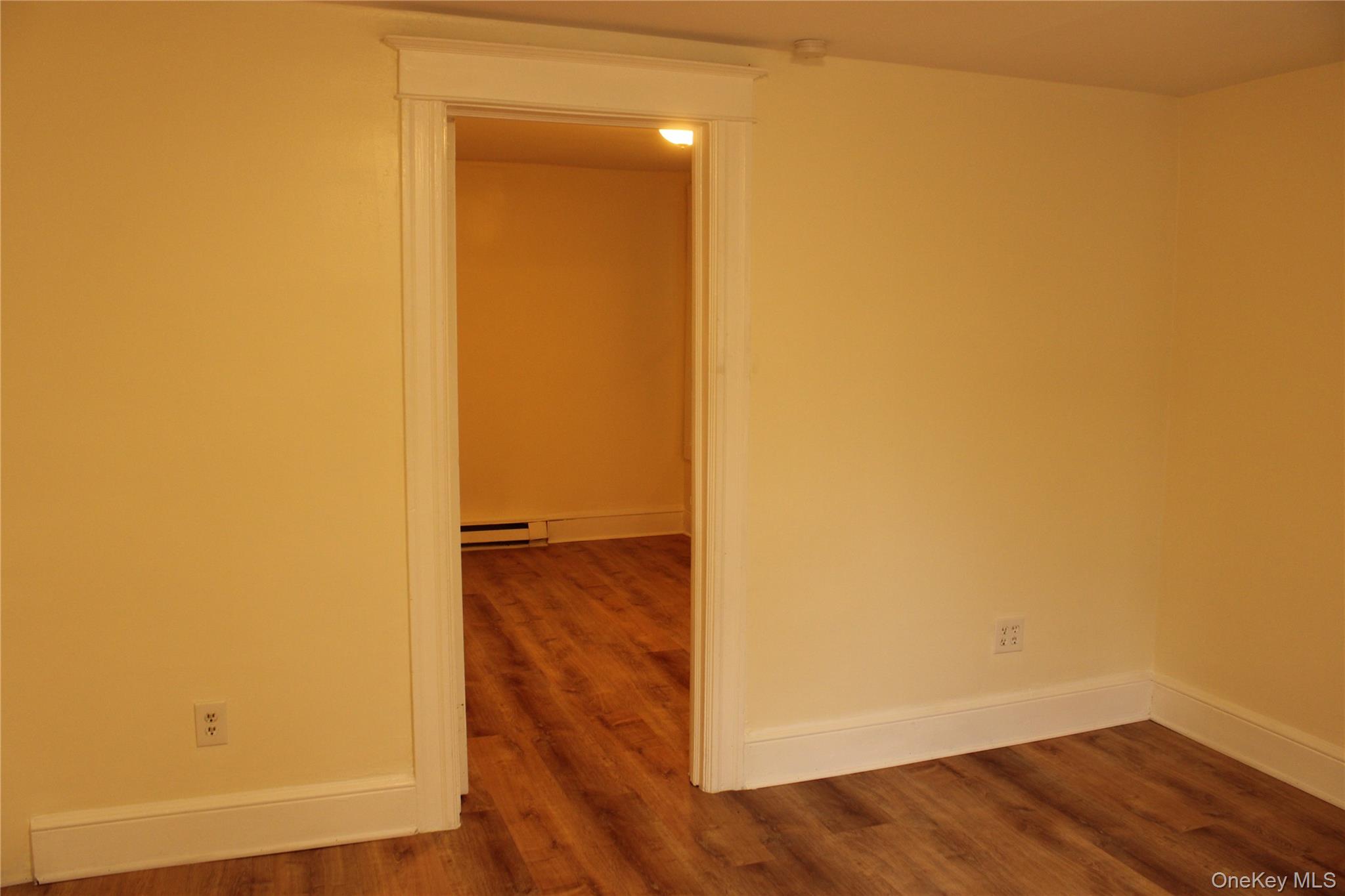 52 South Bridge Street, Unit 1 Poughkeepsie, NY 12601 - Photo 8 of 27 a view of a room with wooden floor