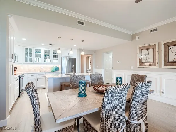 a bed sitting in a spacious bedroom next to a window