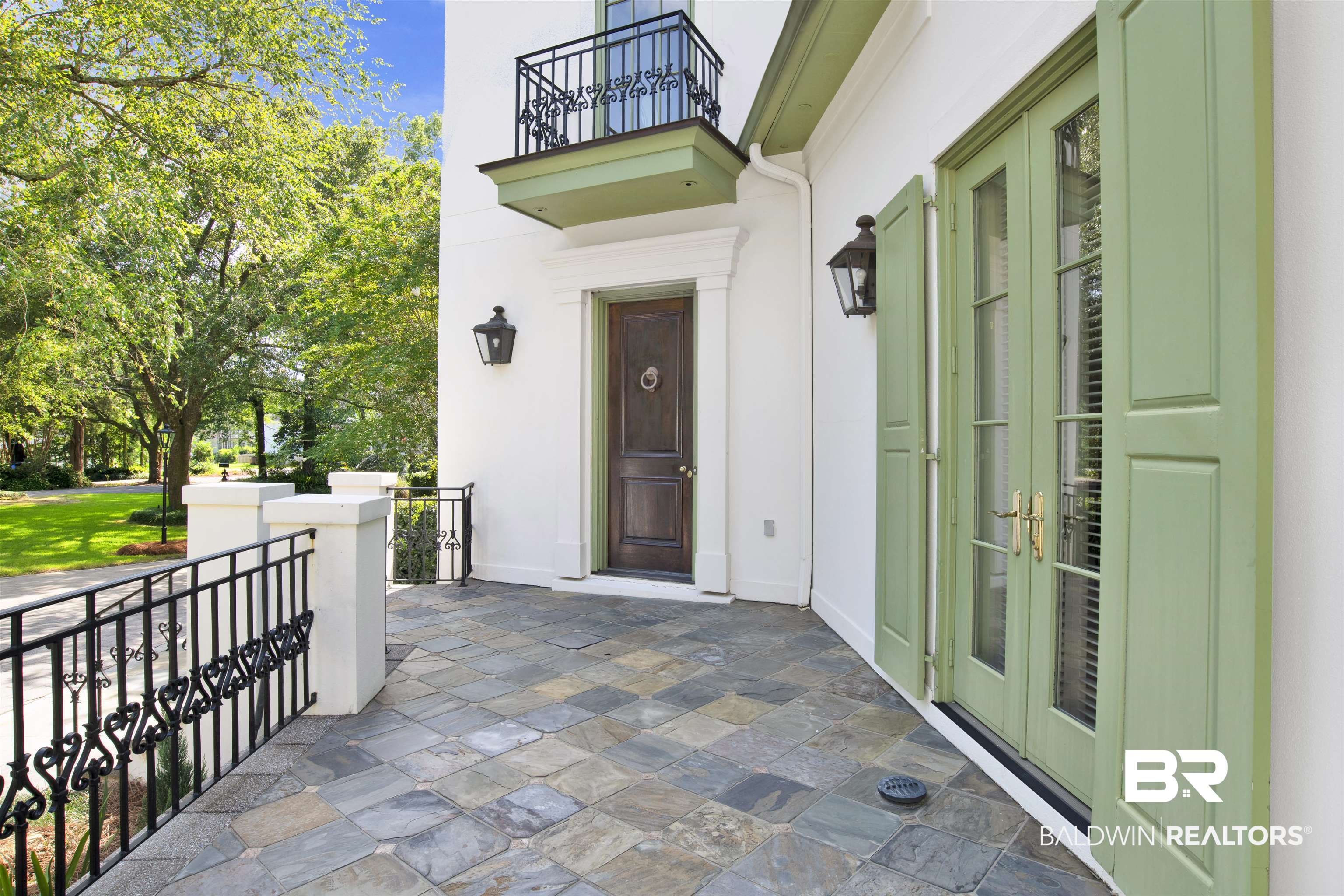 3816 Austill Lane Mobile, AL 36608 - Photo 9 of 80 Doorway to property with a balcony, stucco siding, and french doors