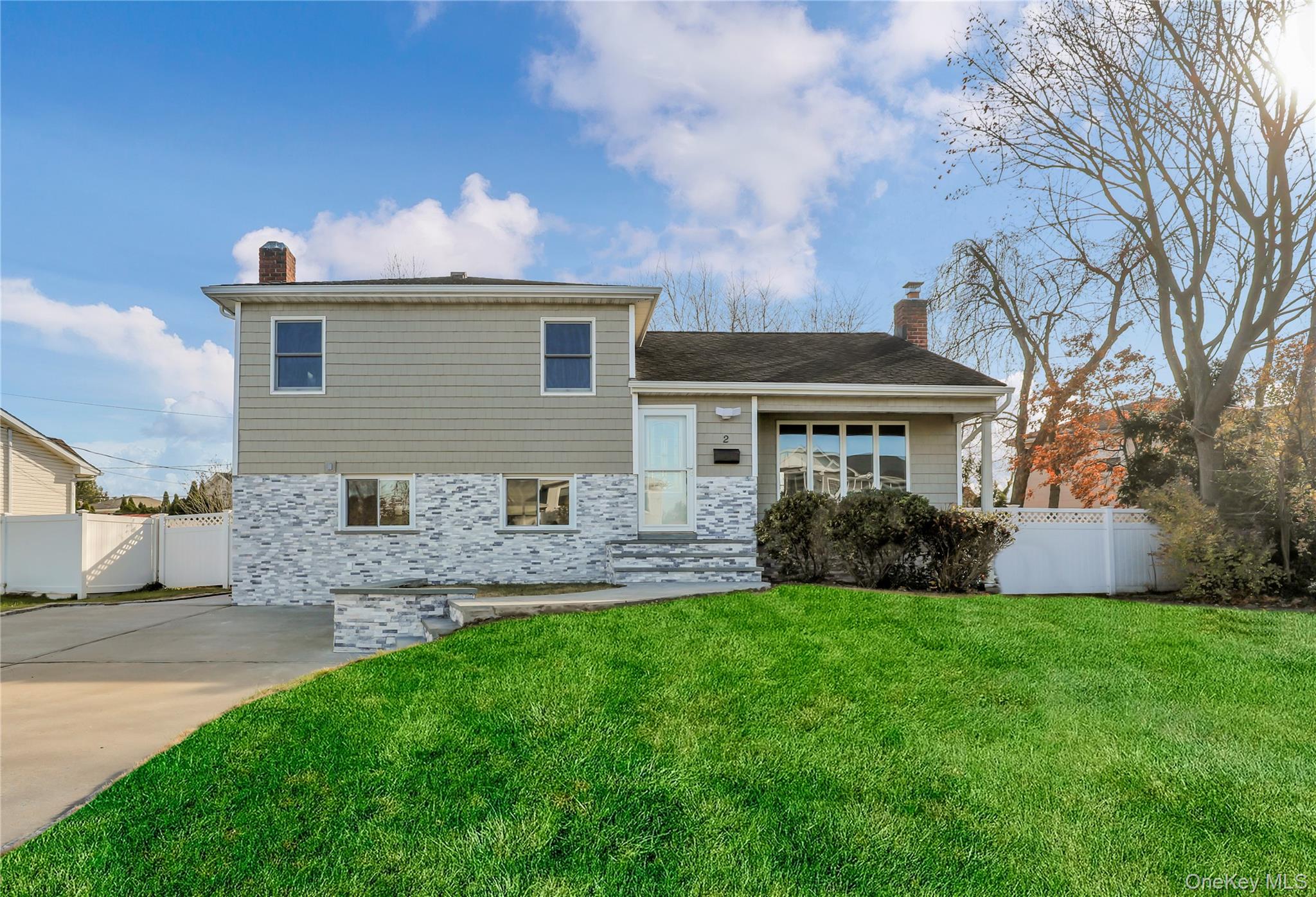 2 Walnut Drive Syosset, NY 11791 - Photo 1 of 1 a front view of house with yard and green space