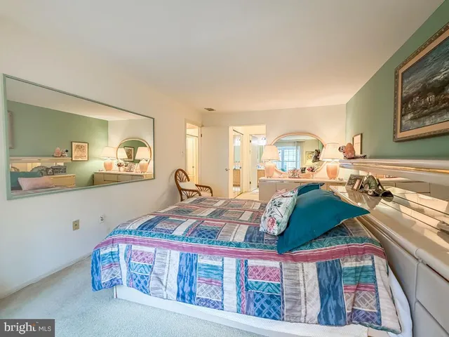 a bedroom with furniture and a rug