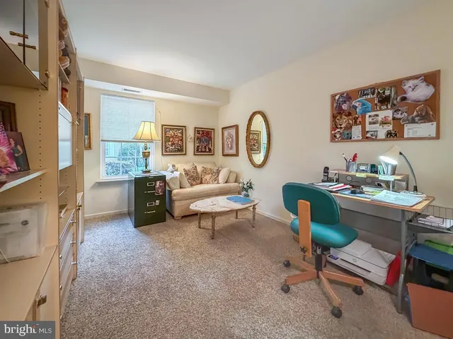 a bathroom with a toilet a sink and a mirror
