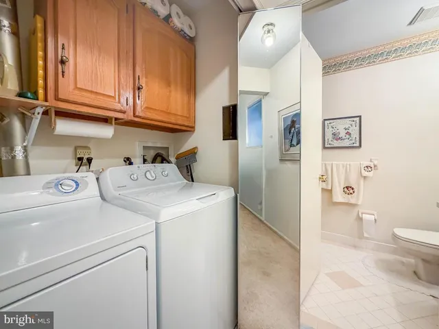a living room with furniture and flowers