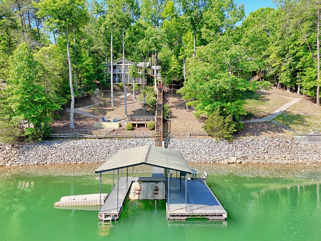 456 Deaver Cove Road Blairsville, GA 30512 - Photo 62 of 83 a view of a wooden deck with a yard