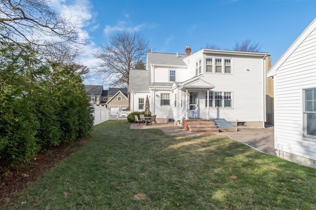 76 Stevens Road Needham, MA 02492 - Photo 26 of 26 a front view of a house with yard porch and outdoor seating