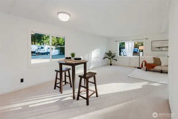 a kitchen with cabinets stainless steel appliances and wooden floor