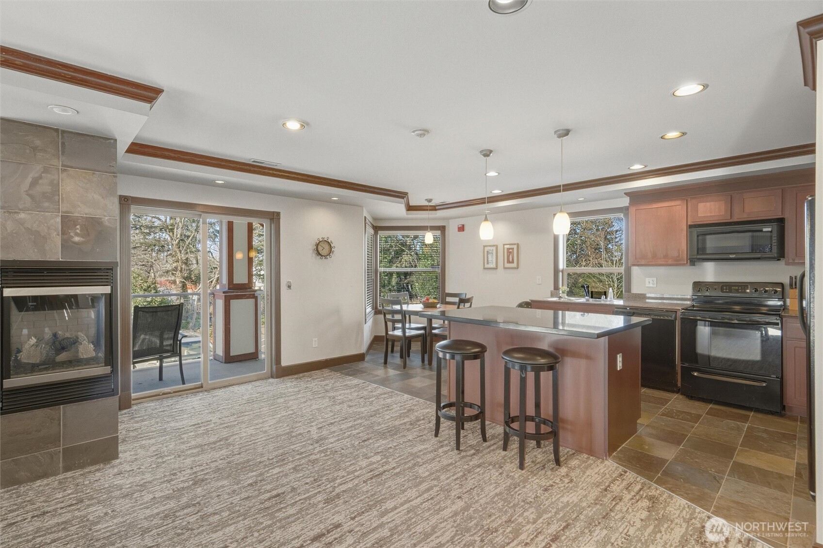255 West Bakerview Road, Unit B103 Bellingham, WA 98226 - Photo 36 of 40 a kitchen with lots of wooden furniture a appliances and dining table