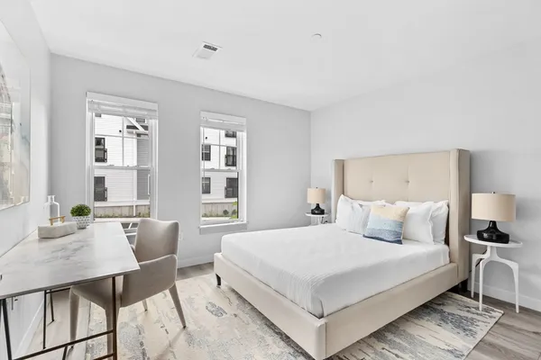 a view of a dining room with furniture and a window