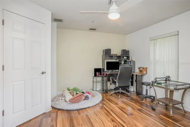a workspace with furniture and wooden floor