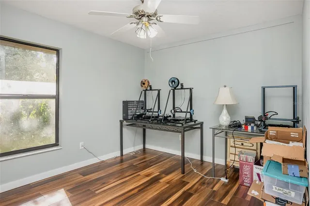 a living room with furniture a chandelier and a window