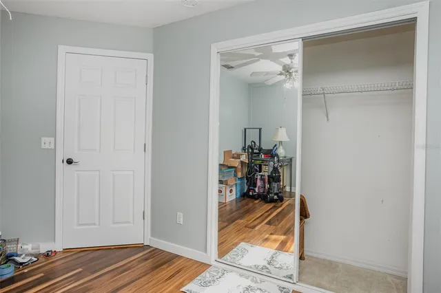 a view of walk in closet with living room