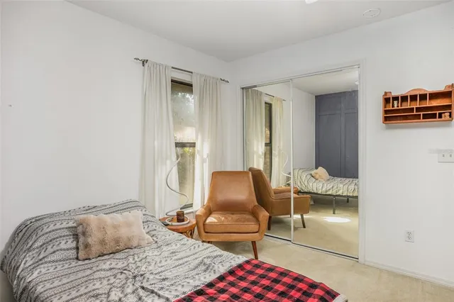 a bedroom with furniture and a window