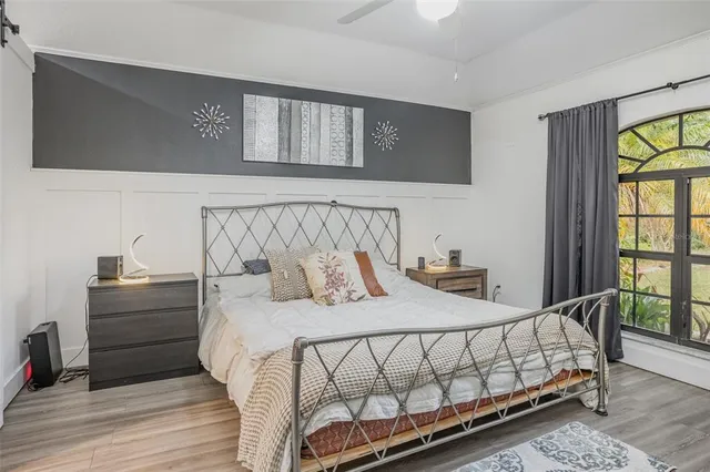 a bedroom with a bed and a window