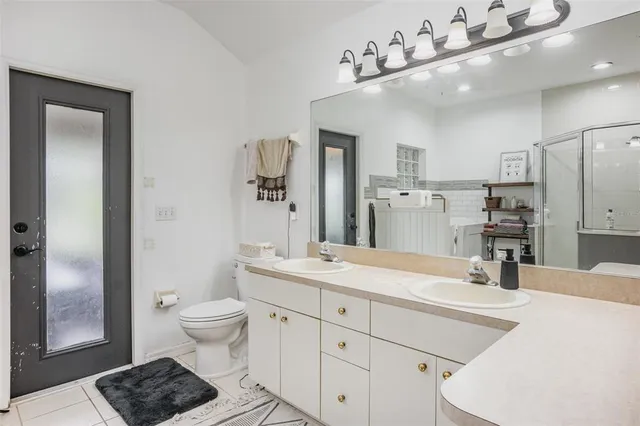 a kitchen with a sink appliances and cabinets
