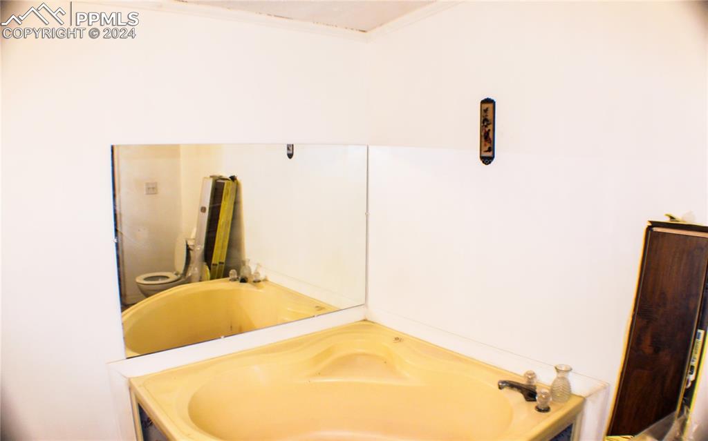 3705 South Johnson Road Rush, CO 80833 - Photo 13 of 31 a bathroom with a tub