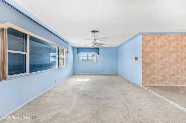 a view of an empty room with a large window