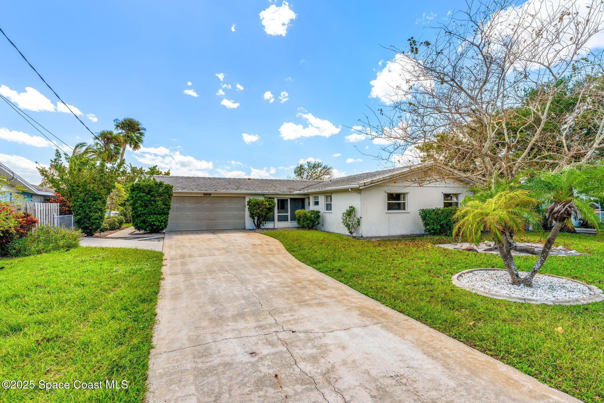 272 Bahama Boulevard Cocoa Beach, FL 32931 - Photo 2 of 63 a front view of a house with garden