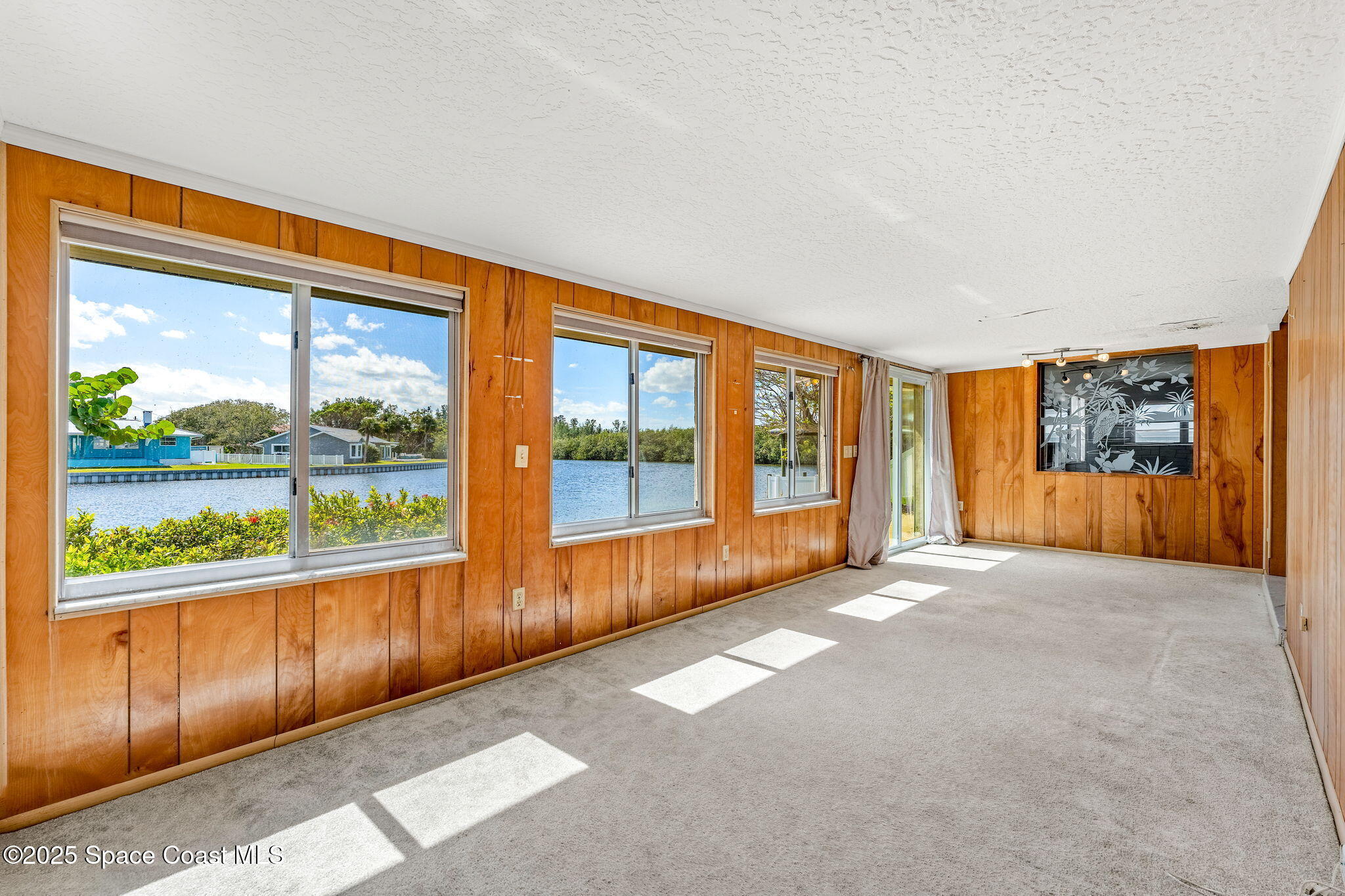 272 Bahama Boulevard Cocoa Beach, FL 32931 - Photo 26 of 63 a view of an empty room with a large window