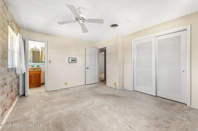 an aerial view of a house with a lake view